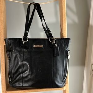 Black coach purse, 15” wide, 12” high, shoulder straps 10”